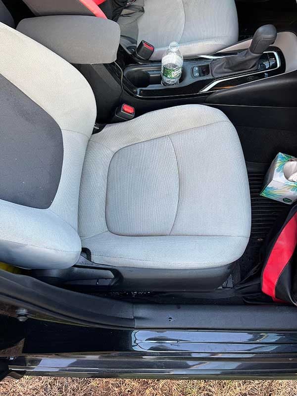 Car seat being cleaned