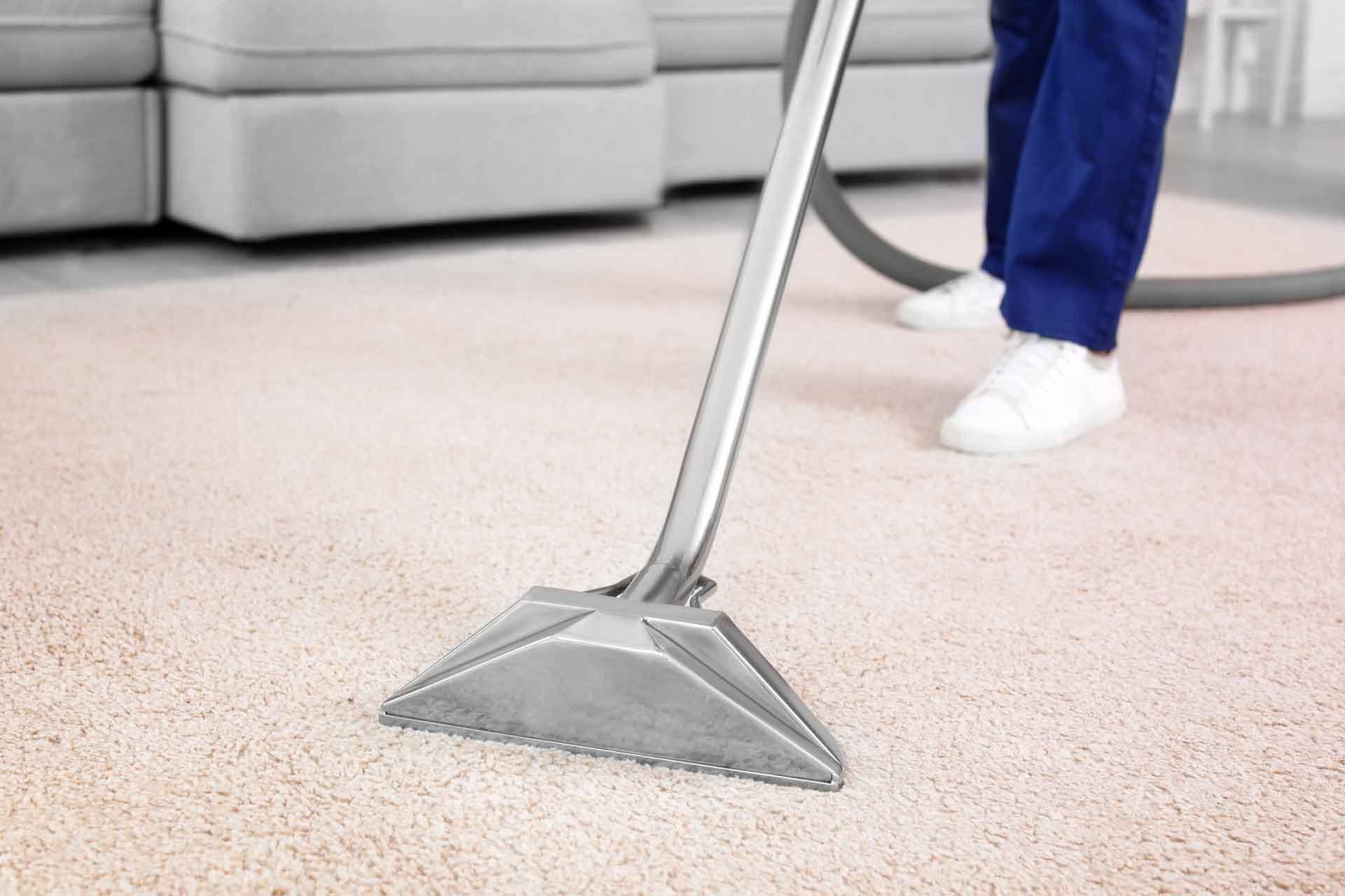 Cleaning wand on a light area rug