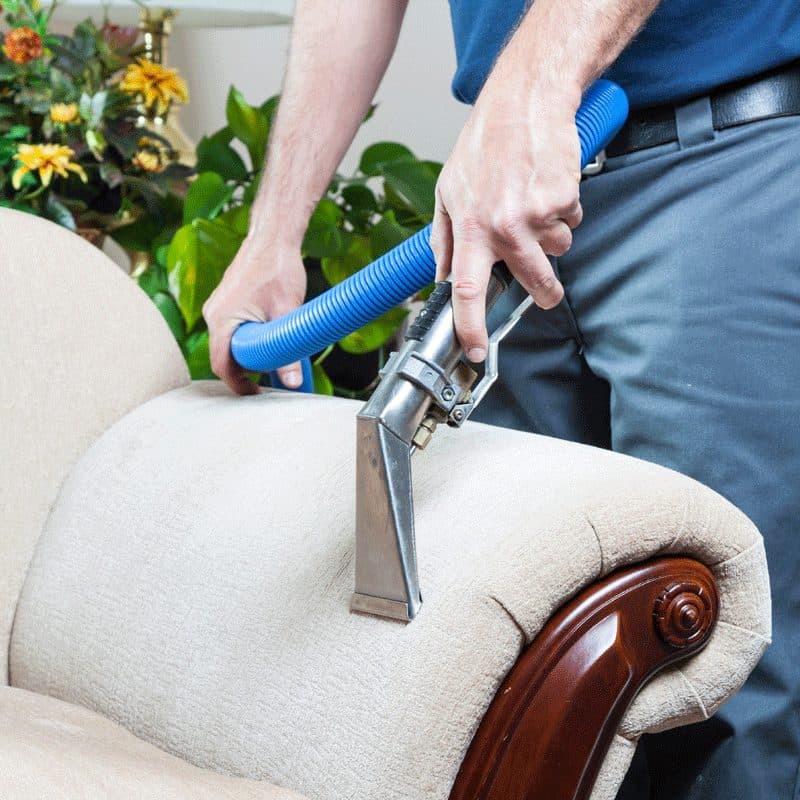 Upholstery cleaning on a light fabric sofa